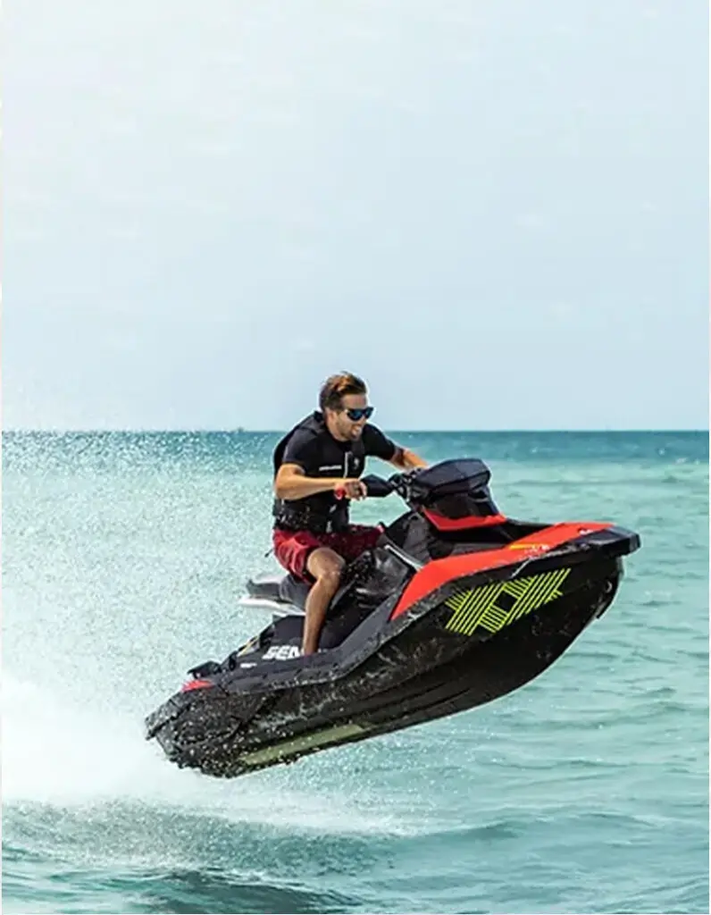 Attendees on jet skis at the Recharge Conference enjoying the sunny San Diego coast.